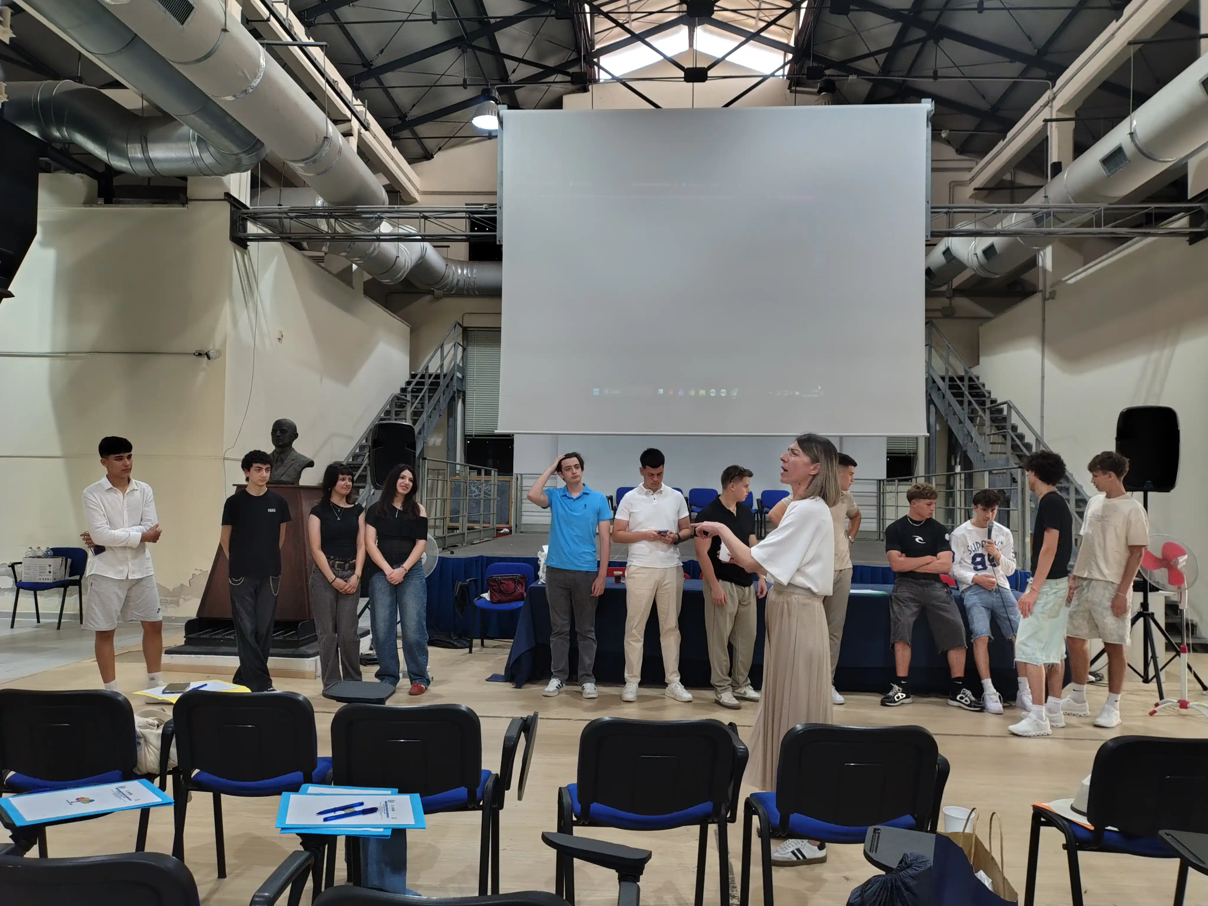 Students from the partner schools standing in a row during an interactive session led by a presenter at the Blended Mobility in Naples